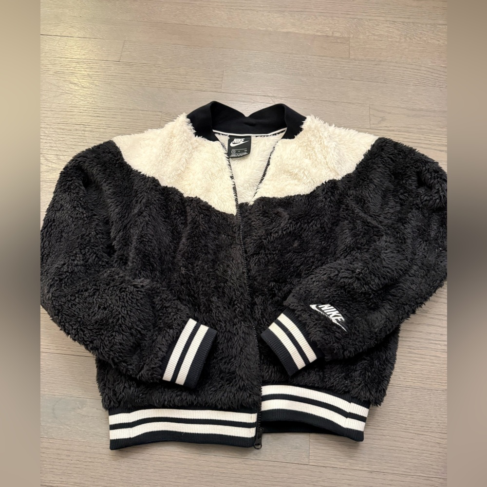 NIKE varsity fleece jacket.